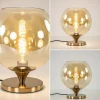elegante_tafellamp_donker_3.webp Outlet Straluma Elegante tafellamp donker goud met amber glazen bol 25 cm