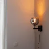 mat_zwarte_wandlamp_met_s_4.webp Best Sale Straluma Mat zwarte wandlamp met smoke glazen bol 20 cm