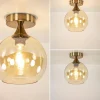 plafondlamp_toilet_goud_m_3.webp Discount Straluma Plafondlamp toilet goud met amber glas
