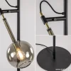 zwartmessing_vloerlamp_me_3.webp New Straluma Zwart/messing vloerlamp met smoke glas